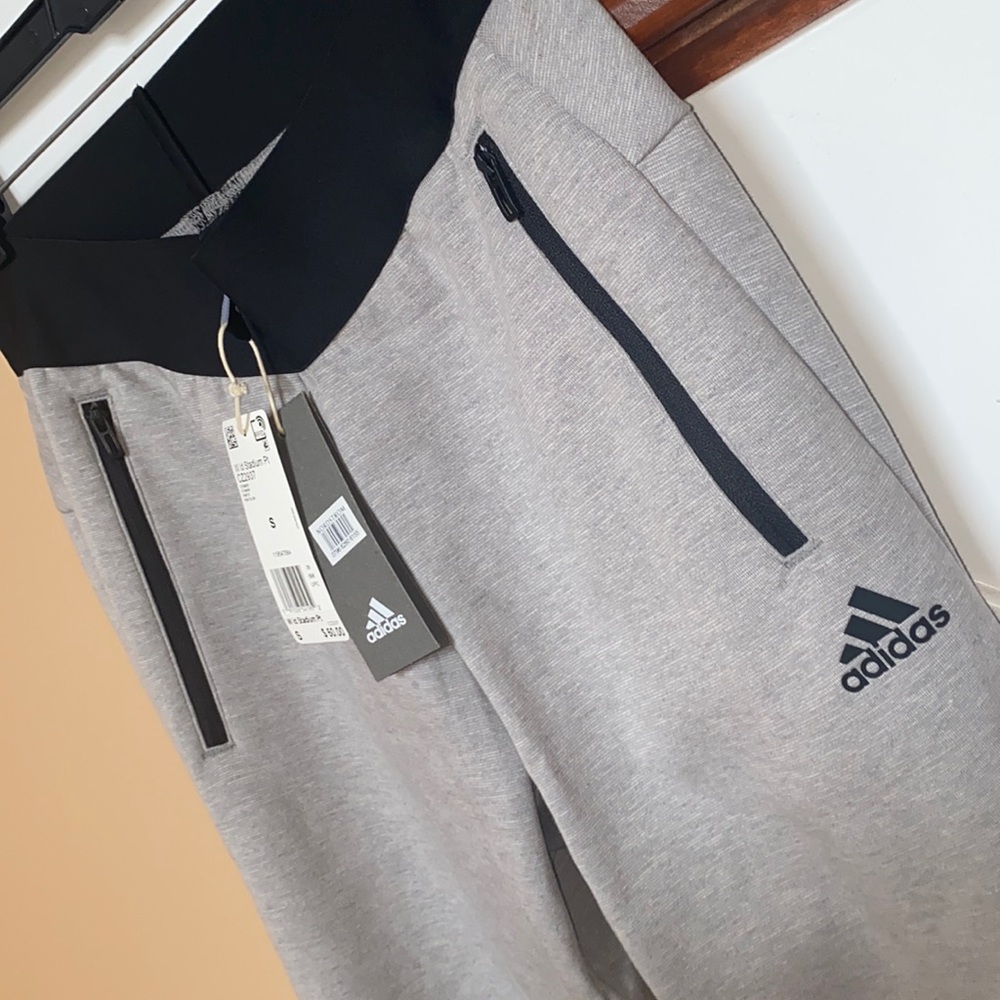 BRAND NEW W/ TAGS. ADIDAS jogger with black elastic high-waist and zippers.